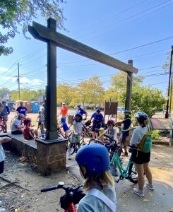 Cub scouts and parents on bicycles preparing to ride on the Middlesex Greenway